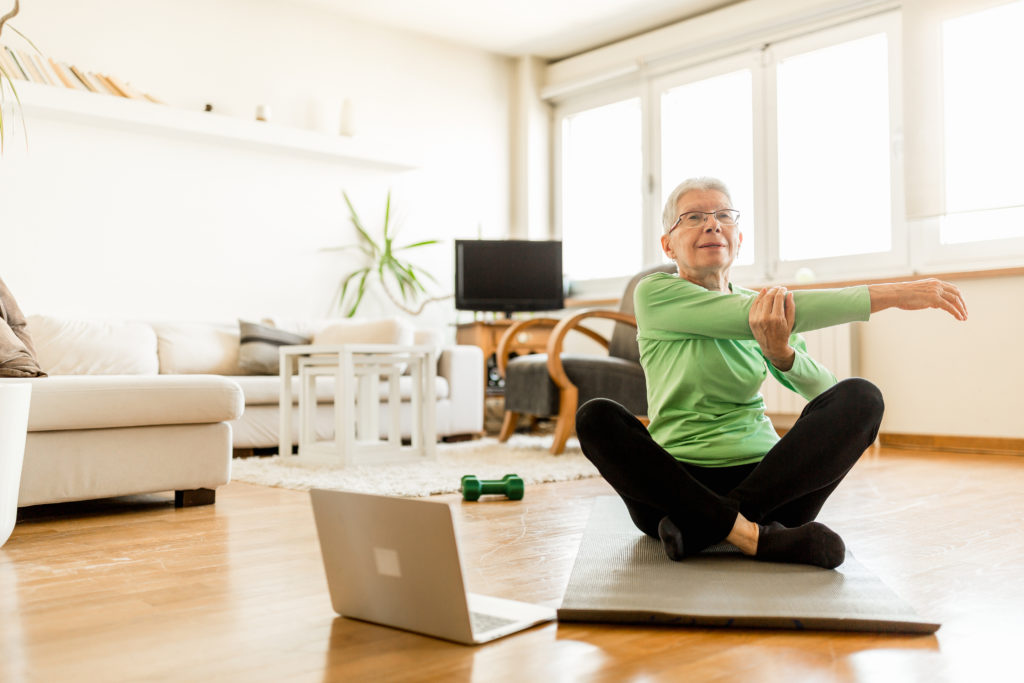 older woman exercising at home